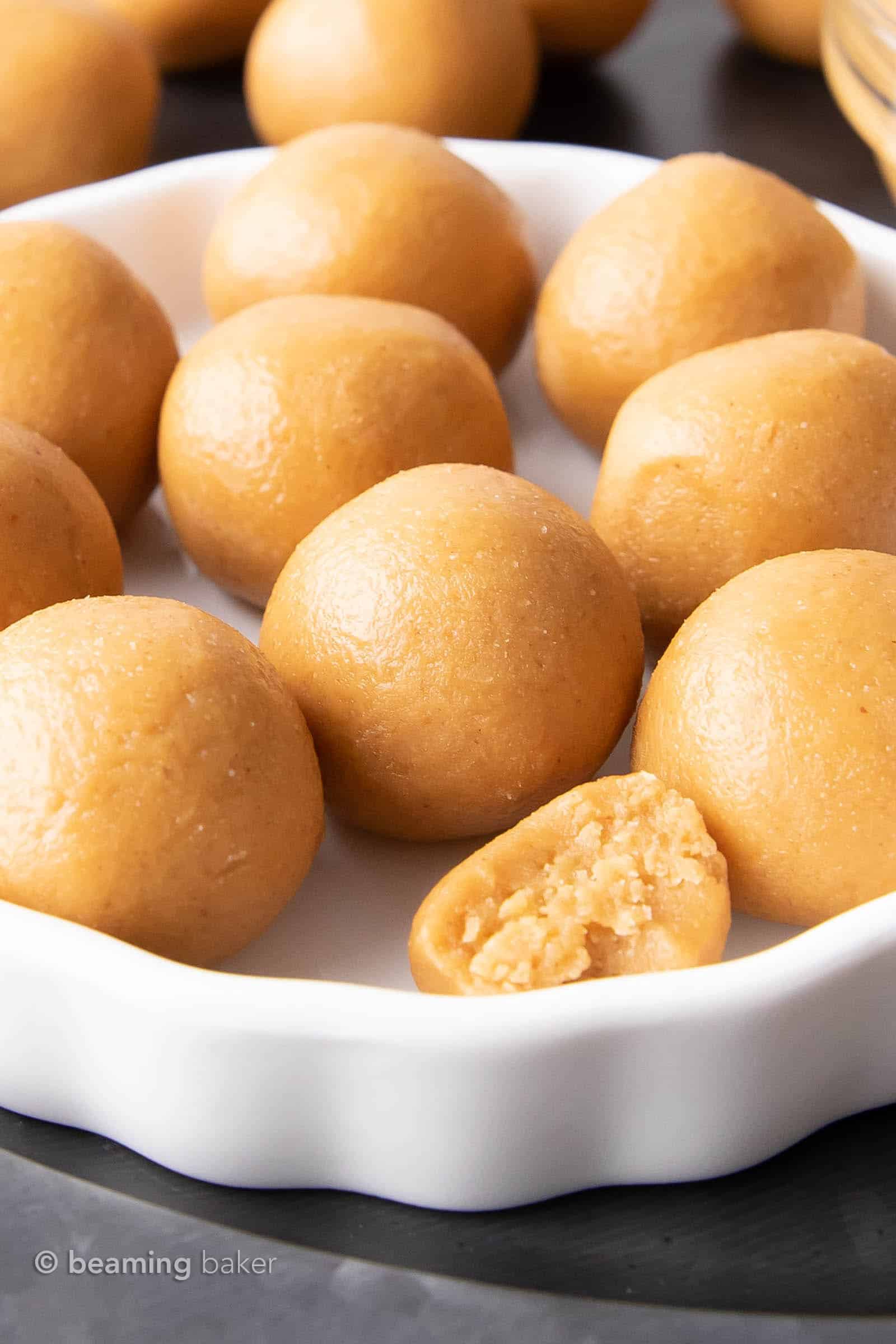 White ceramic serving tray with peanut butter balls spread on top.