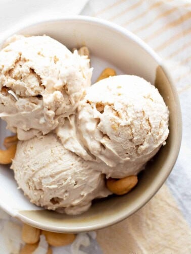 Cashew Ice Cream Recipe: just 3 ingredients for deliciously creamy cashew ice cream. The best cashew ice cream recipe—no churn, super easy and satisfying! Vegan, Paleo. #Cashew #IceCream #CashewIceCream #CashewButter | Recipe at BeamingBaker.com