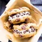 Vegan Ice Cream Sandwiches (GF): soft-baked gluten free chocolate chip cookies sandwich a thick layer of delicious creamy vegan ice cream. The best gluten free ice cream sandwiches! #Vegan #GlutenFree #IceCreamSandwiches #IceCream | Recipe at BeamingBaker.com