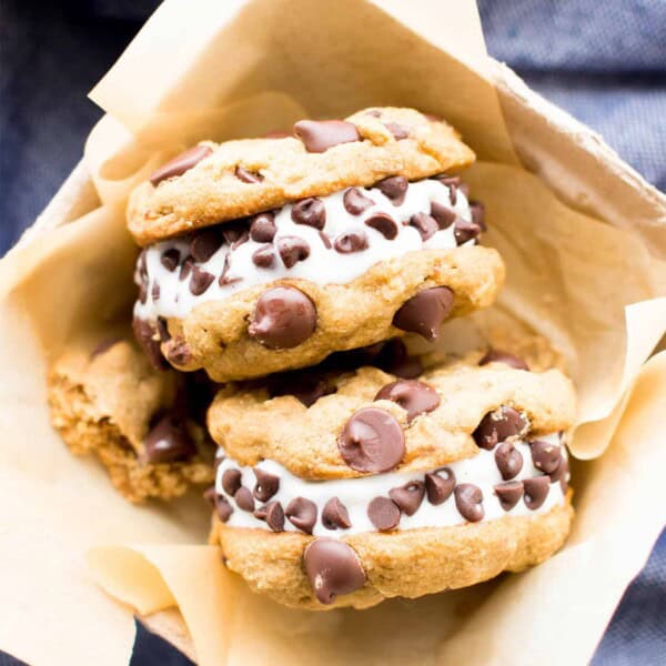 Vegan Ice Cream Sandwiches (GF): soft-baked gluten free chocolate chip cookies sandwich a thick layer of delicious creamy vegan ice cream. The best gluten free ice cream sandwiches! #Vegan #GlutenFree #IceCreamSandwiches #IceCream | Recipe at BeamingBaker.com