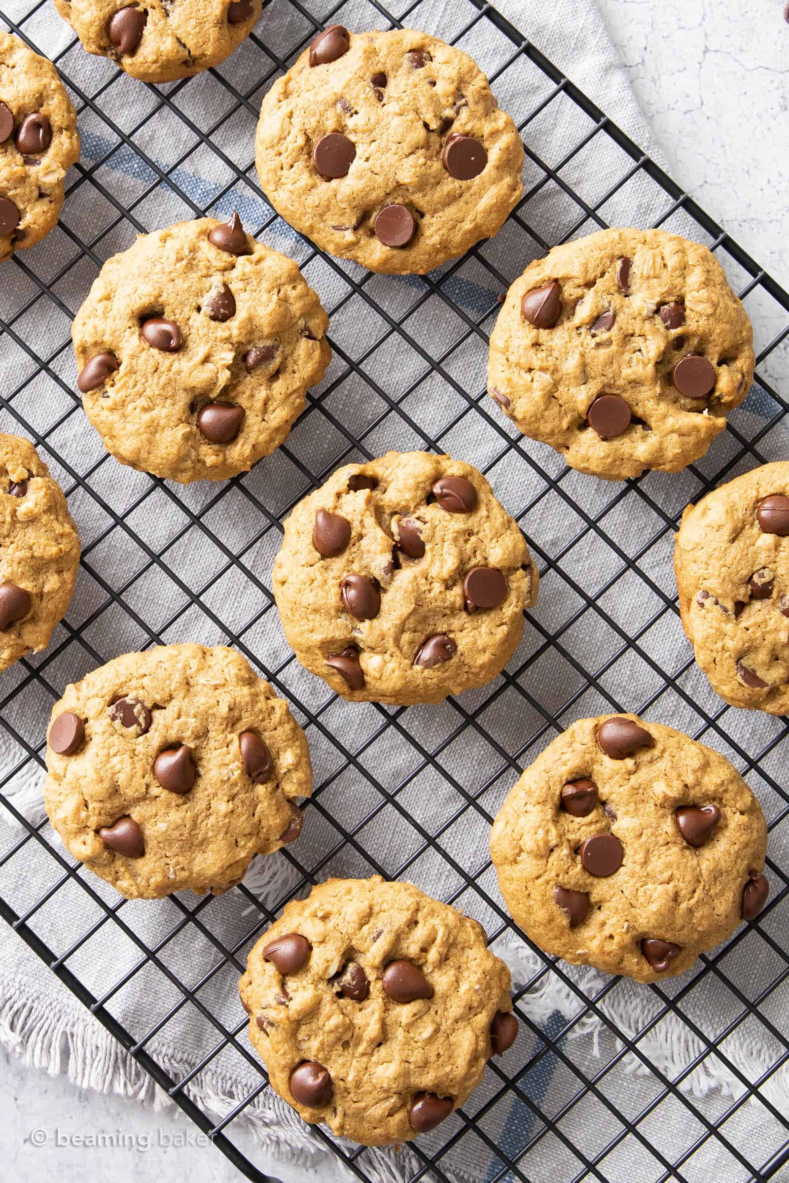 Closeup of oat flour chocolate chip cookies on black cooling rack