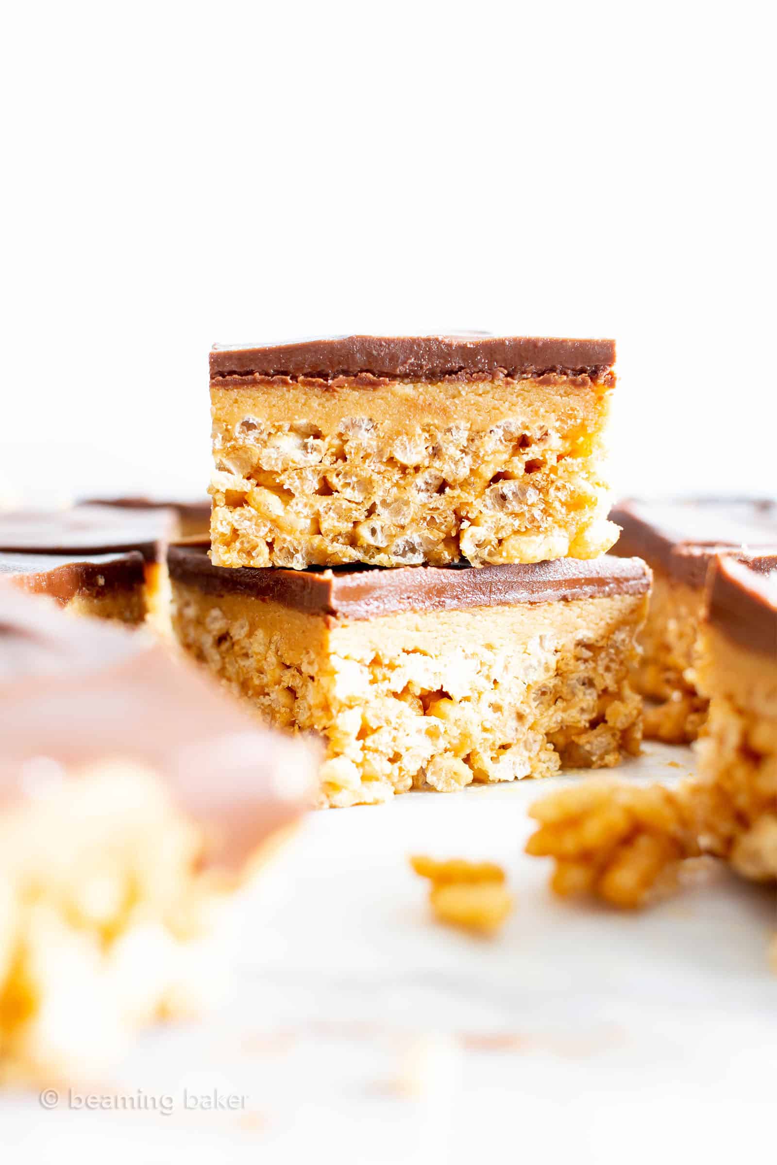 no bake peanut butter rice crispy treats in a stack of two with a white background 