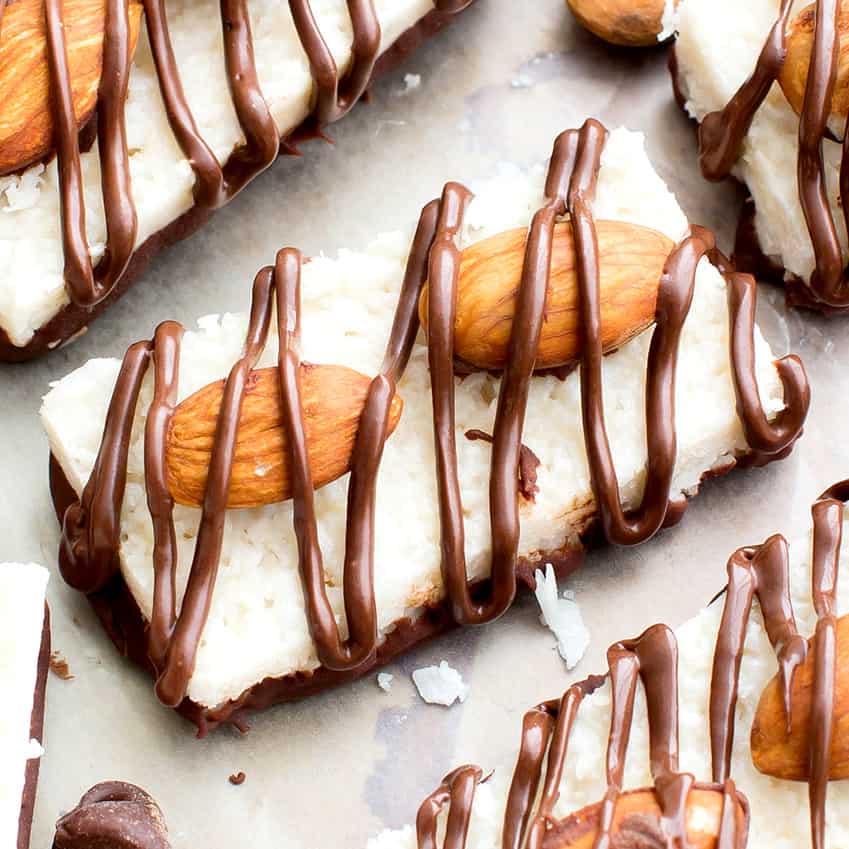 Overhead picture of vegan almond joy bars on parchment paper