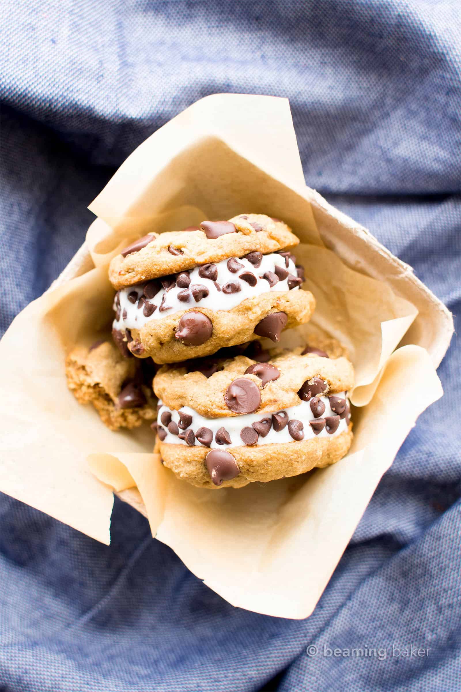 Vegan Ice Cream Sandwiches (GF): soft-baked gluten free chocolate chip cookies sandwich a thick layer of delicious creamy vegan ice cream. The best gluten free ice cream sandwiches! #Vegan #GlutenFree #IceCreamSandwiches #IceCream | Recipe at BeamingBaker.com