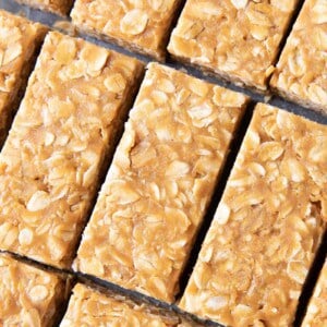 3 Ingredient No Bake Peanut Butter Granola Bars (GF): this homemade peanut butter granola bars recipe so EASY! The best oatmeal peanut butter granola bars recipe without honey, that taste like honey roasted peanuts. Healthy, Vegan, Gluten Free. #PeanutButter #GranolaBars #NoBake #Oatmeal | Recipe at BeamingBaker.com