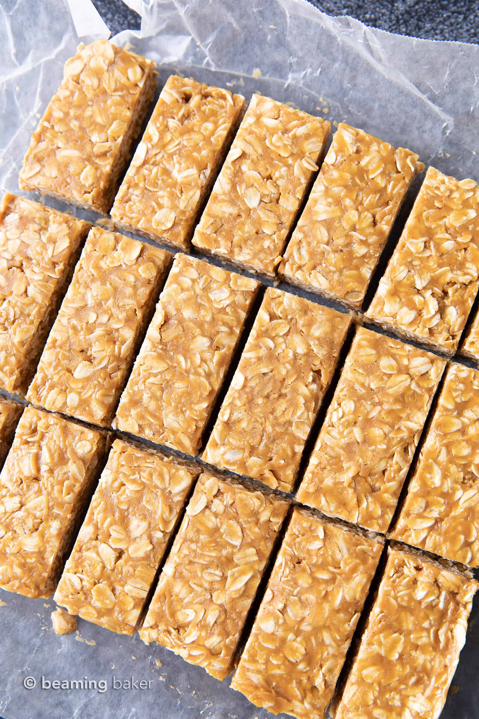 3 Ingredient No Bake Peanut Butter Granola Bars (GF): this homemade peanut butter granola bars recipe is so EASY! The best oatmeal peanut butter granola bars recipe without honey, that tastes like honey roasted peanuts. Healthy, Vegan, Gluten Free. #PeanutButter #GranolaBars #NoBake #Oatmeal | Recipe at BeamingBaker.com