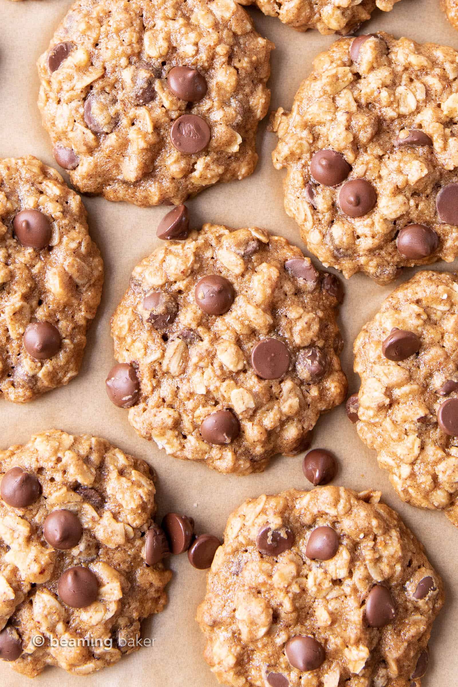 Easy Healthy Oatmeal Chocolate Chip Cookies: this easy healthy oatmeal chocolate chip cookies recipe yields chewy cookies with crispy edges and lots of chocolate chips! Vegan, Gluten-Free, Dairy-Free, Healthy. #Healthy #OatmealCookies #HealthyCookies #ChocolateChip | Recipe at BeamingBaker.com