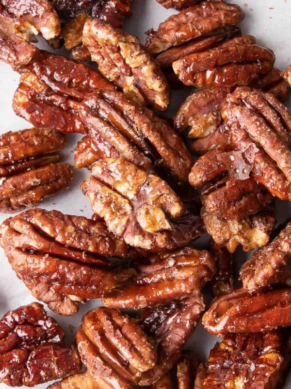 Vegan Candied Pecans: learn how to make candied pecans with just 4 healthy ingredients! Prep time is just 5 mins for deliciously glazed candied pecans in this lower sugar recipe! #Pecans #Healthy #Vegan #Fall | Recipe at BeamingBaker.com