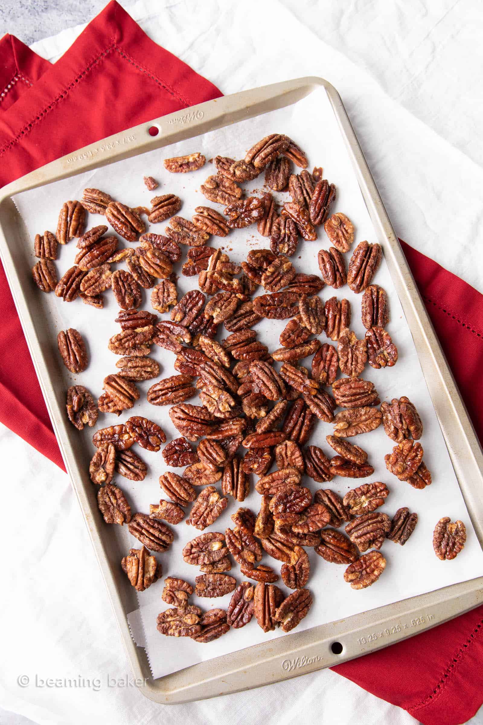 Vegan Candied Pecans: learn how to make candied pecans with just 4 healthy ingredients! Prep time is just 5 mins for deliciously glazed candied pecans in this lower sugar recipe! #Pecans #Healthy #Vegan #Fall | Recipe at BeamingBaker.com