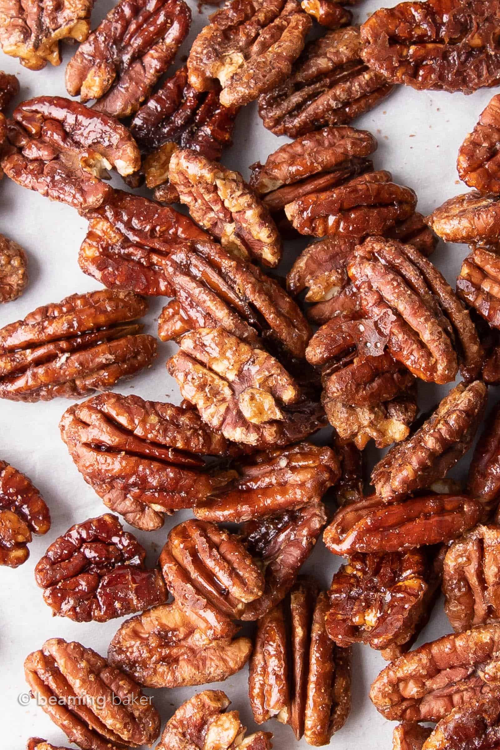 Vegan Candied Pecans: learn how to make candied pecans with just 4 healthy ingredients! Prep time is just 5 mins for deliciously glazed candied pecans in this lower sugar recipe! #Pecans #Healthy #Vegan #Fall | Recipe at BeamingBaker.com