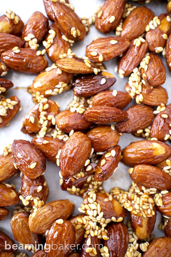 Honey Sesame Almonds: sweet and smoky skillet-roasted almonds glazed with a coat of honey and satisfying sesame seeds. BEAMINGBAKER.COM