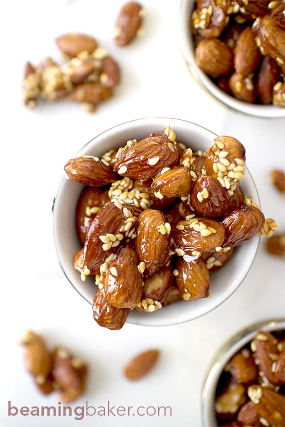 Honey Sesame Almonds: sweet and smoky skillet-roasted almonds glazed with a coat of honey and satisfying sesame seeds. BEAMINGBAKER.COM