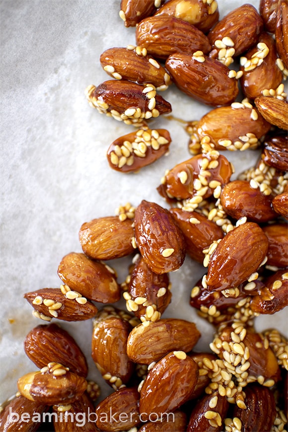 Honey Sesame Almonds: sweet and smoky skillet-roasted almonds glazed with a coat of honey and satisfying sesame seeds. BEAMINGBAKER.COM