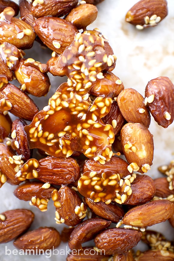 Honey Sesame Almonds: sweet and smoky skillet-roasted almonds glazed with a coat of honey and satisfying sesame seeds. BEAMINGBAKER.COM