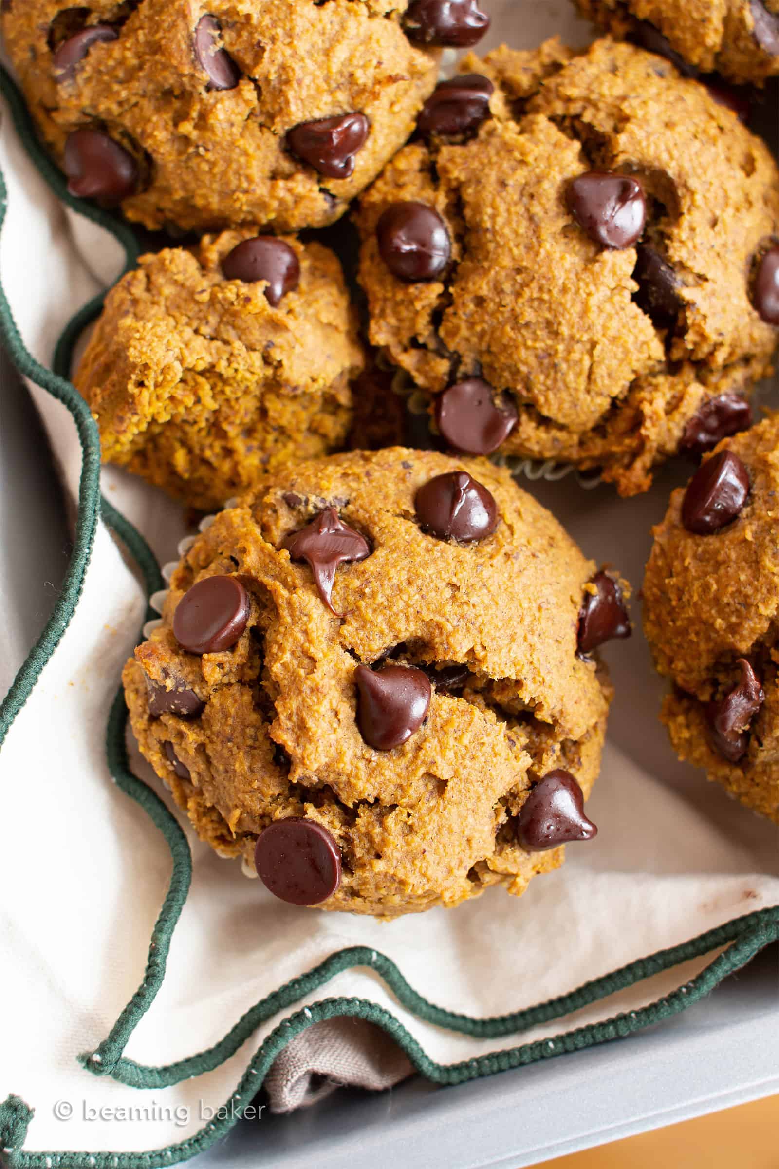 Gluten Free Pumpkin Chocolate Chip Muffins Recipe (GF): this easy gluten free pumpkin muffins recipe makes perfectly spiced GF pumpkin muffins! Made in 1-bowl with healthy, whole ingredients. #Pumpkin #Muffins #Chocolate #GlutenFree #Vegan | Recipe at BeamingBaker.com
