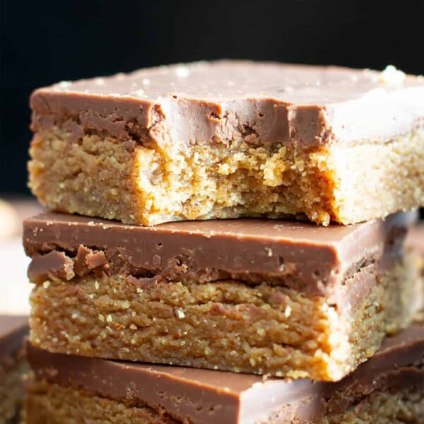 No Bake Paleo Chocolate Almond Butter Bars: this easy paleo dessert recipe yields deliciously thick no bake almond butter bars topped with velvety paleo chocolate. It’s the best quick & simple paleo sweets recipe! #Paleo #NoBake #Dessert #Vegan #Treats | Recipe at BeamingBaker.com