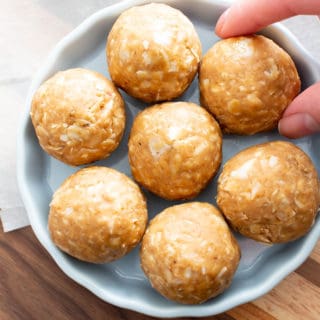 No Bake Peanut Butter Coconut Balls: this healthy energy bites recipe yields chewy, sweet ‘n nutty vegan protein balls with just 6 ingredients! Easy, Gluten Free, Protein Balls! #PeanutButter #Coconut #Healthy #Vegan #GlutenFree | Recipe at BeamingBaker.com