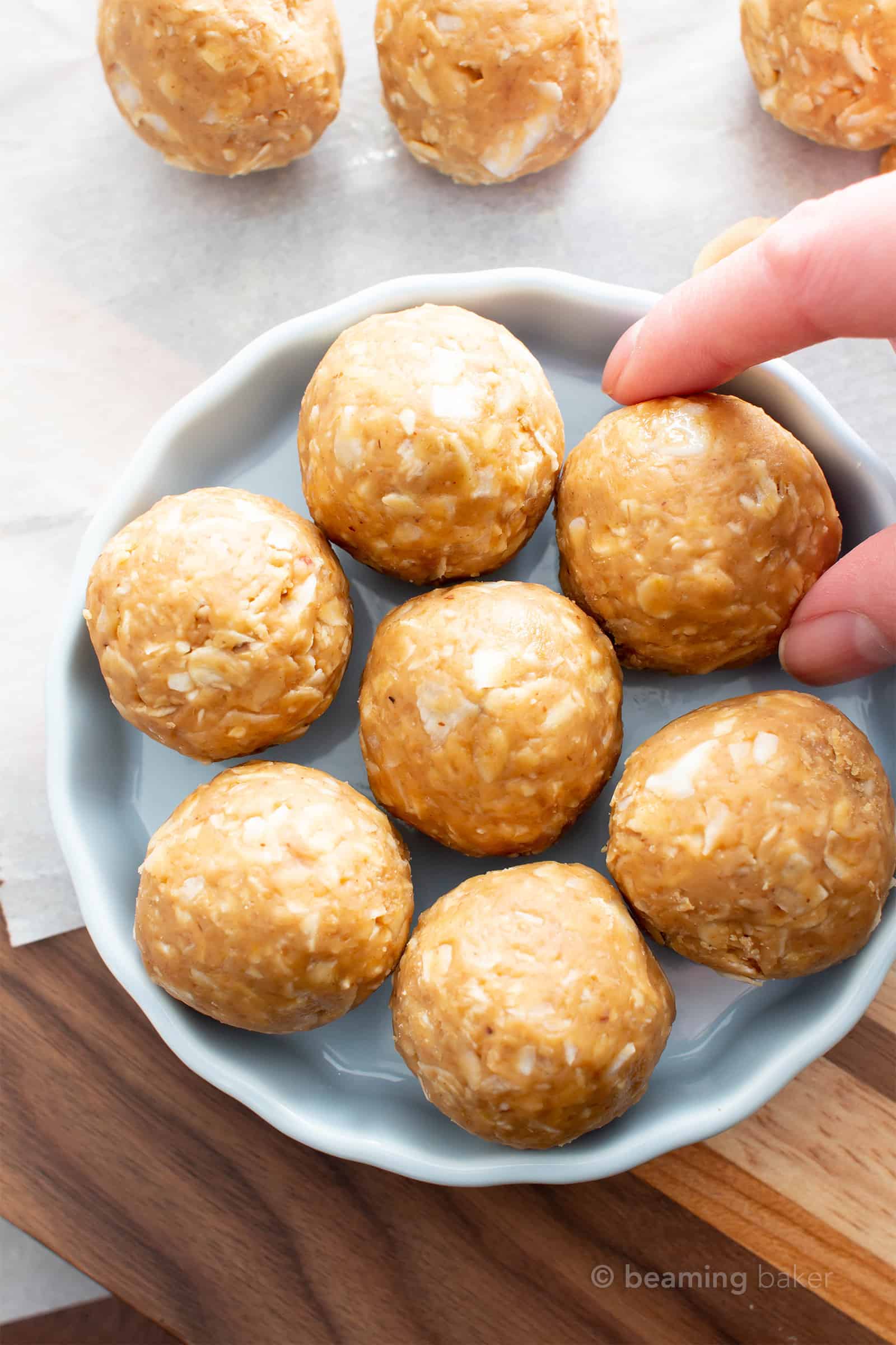 No Bake Peanut Butter Coconut Balls: this healthy energy bites recipe yields chewy, sweet ‘n nutty vegan protein balls with just 6 ingredients! Easy, Gluten Free, Protein Balls! #PeanutButter #Coconut #Healthy #Vegan #GlutenFree | Recipe at BeamingBaker.com