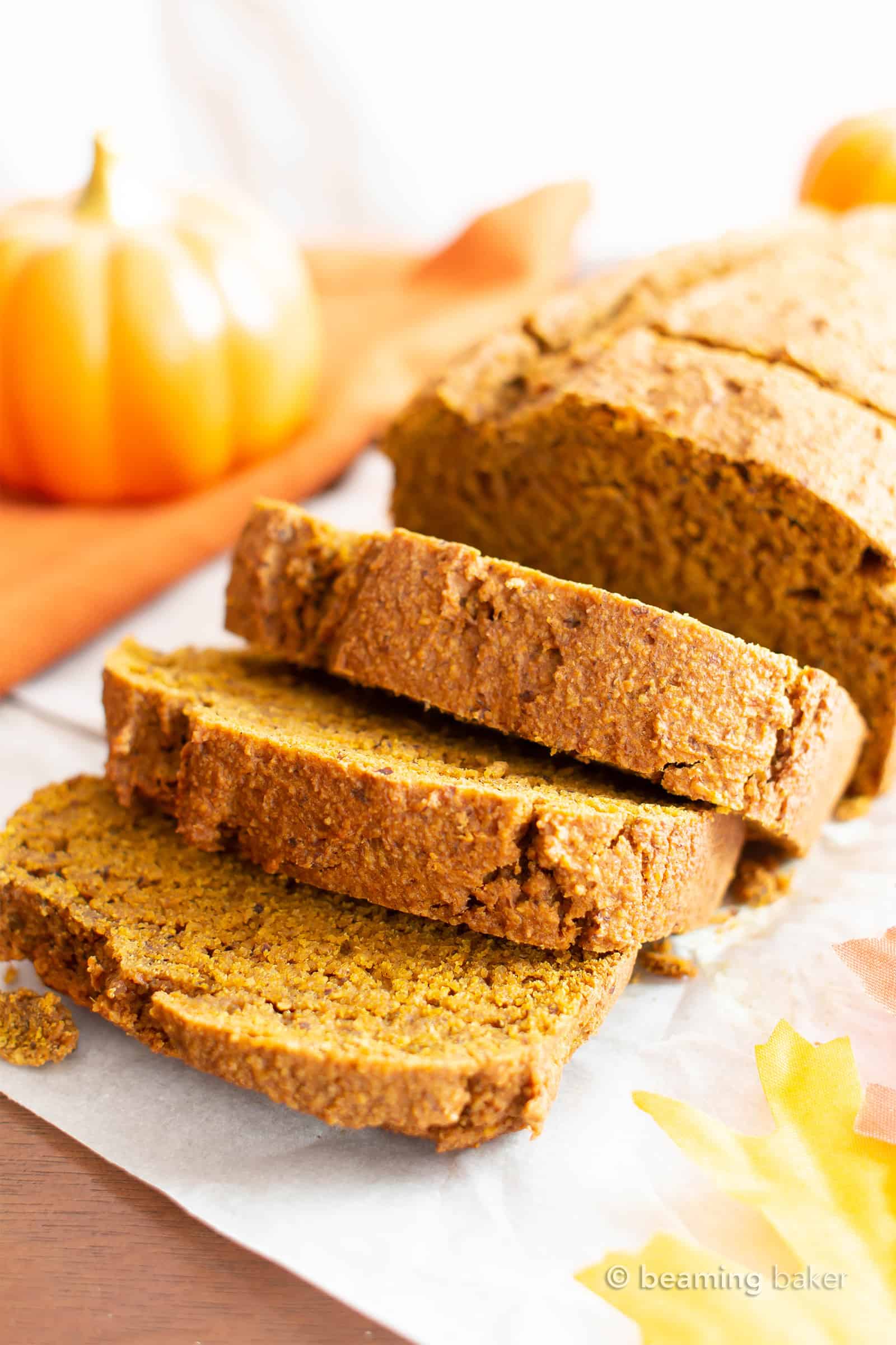 vegan gluten free pumpkin bread slices falling from pumpkin bread loaf