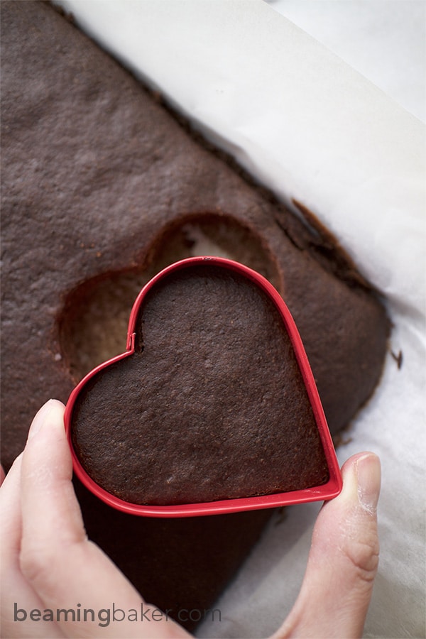 Adorable mini, heart-shaped, two-layer chocolate cakes topped with slightly sweet coconut oil frosting. An impressive and delightful treat to make for any occasion.