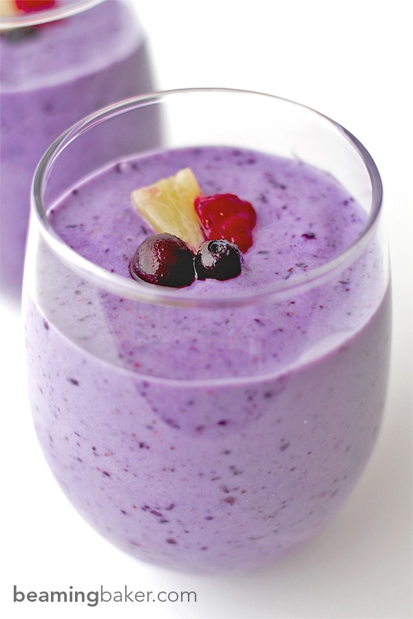 Refreshing, sweet, protein-packed Pineapple Berry Smoothie: made with Greek yogurt, strawberries, blueberries and almond milk, these smoothies are the perfect fruity boost. BEAMINGBAKER.COM #healthy #gymfuel