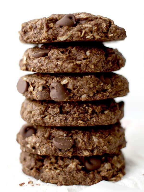 Rich, chewy & indulgent Double Chocolate Chip Cookies - a simple, vegan recipe for twice the chocolate plus coconut oil, coconut sugar and coconut shreds! BEAMINGBAKER.COM #vegan #oatflour