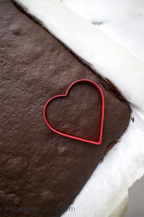 Adorable mini, heart-shaped, two-layer chocolate cakes topped with slightly sweet coconut oil frosting. An impressive and delightful treat to make for any occasion.