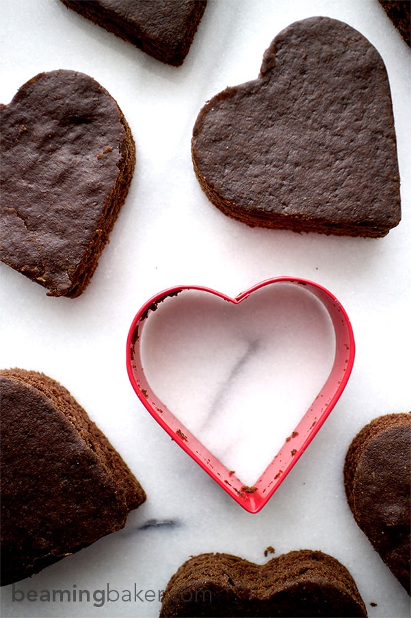 Adorable mini, heart-shaped, two-layer chocolate cakes topped with slightly sweet coconut oil frosting. An impressive and delightful treat to make for any occasion.