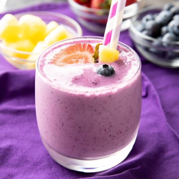 Berry Pineapple Smoothie served with pineapples, blueberries, and strawberries