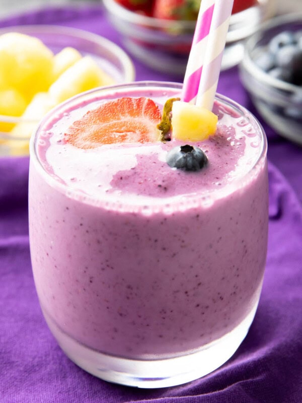 Berry Pineapple Smoothie served with pineapples, blueberries, and strawberries