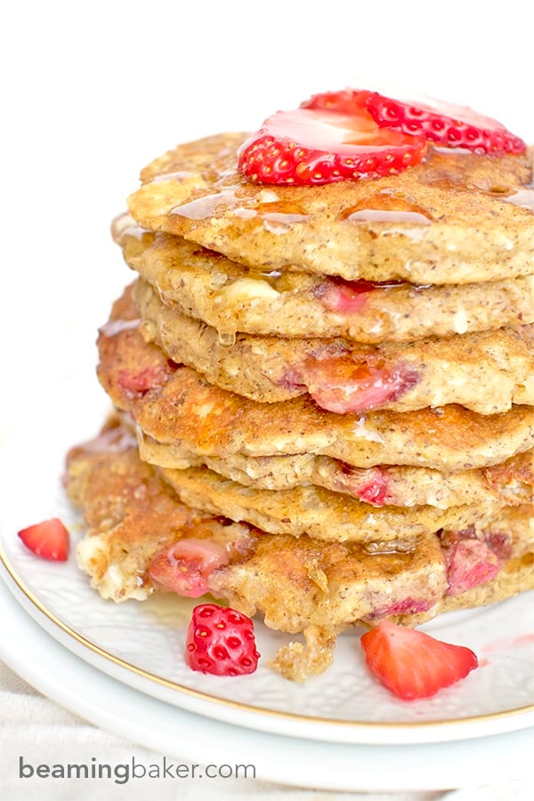beamingbaker.com An easy recipe for the BEST fluffy strawberry white chocolate chip pancakes! Made with simple ingredients: oat flour, almond meal, whole wheat flour and coconut.
