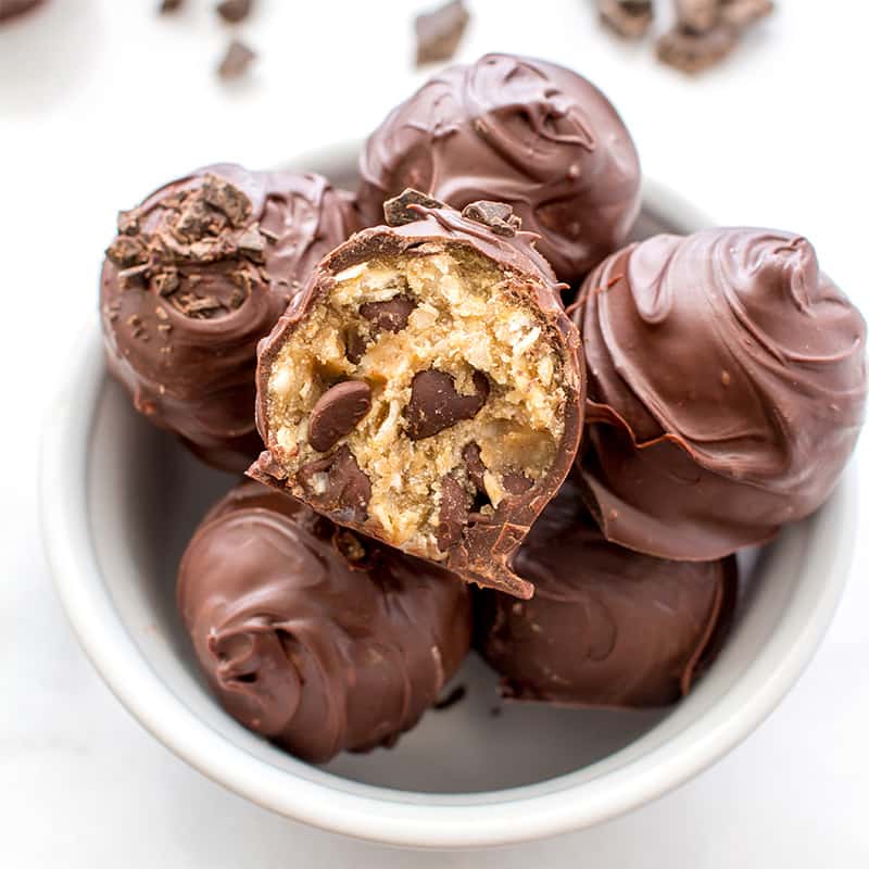 Chocolate Chip Cookie Dough Truffles (V+GF): Decadent chocolate chip cookie dough bites wrapped in a velvety blanket of rich, dark, indulgent chocolate. BEAMINGBAKER.COM. #Vegan #GlutenFree