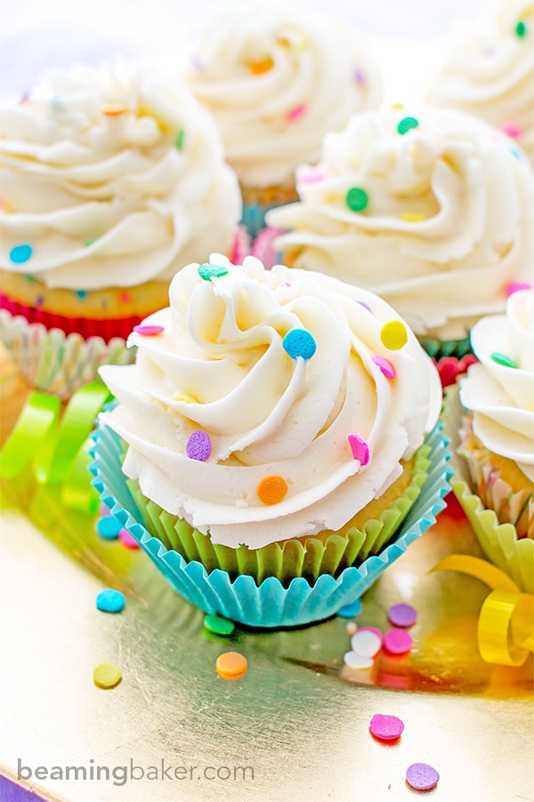 Funfetti Birthday Cupcakes: Moist, classic white cupcakes speckled with funfetti sprinkles and topped with luscious, fluffy vanilla frosting. BEAMINGBAKER.COM #birthday #cupcakes