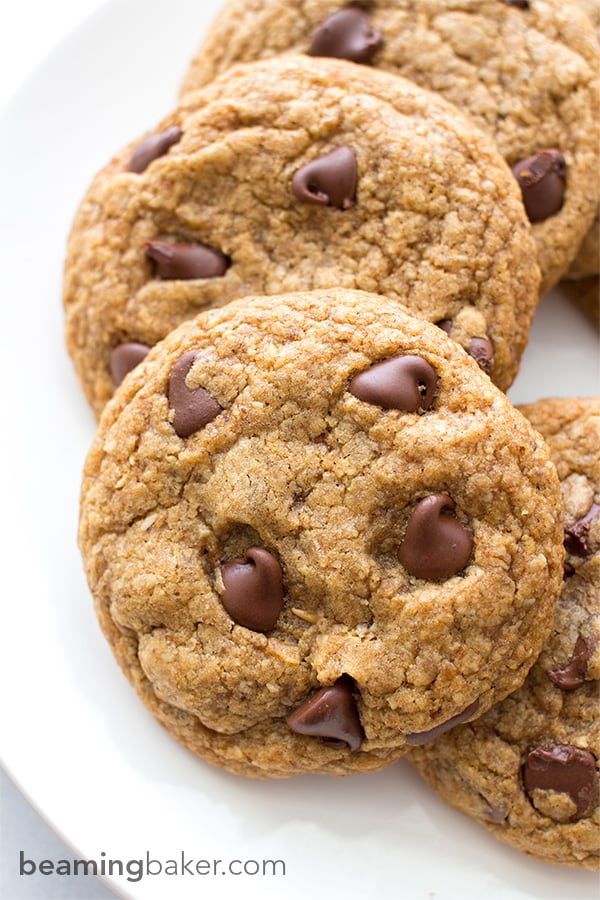 Soft, chewy, crispy on the bottom Healthier Vegan Chocolate Chip Cookies. Made with oat flour, whole wheat flour, organic unrefined coconut sugar and coconut oil. BEAMINGBAKER.COM #VEGAN