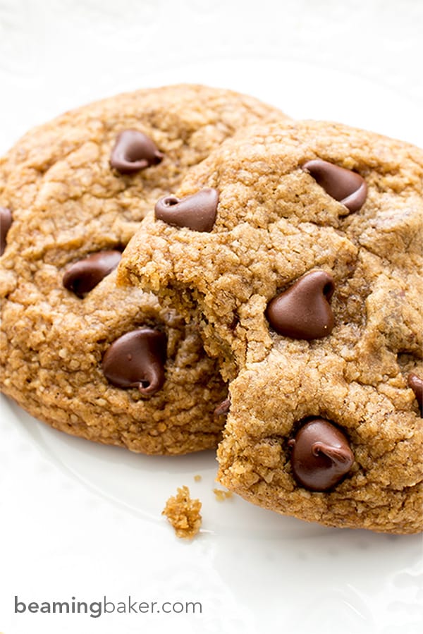 Soft, chewy, crispy on the bottom Healthier Vegan Chocolate Chip Cookies. Made with oat flour, whole wheat flour, organic unrefined coconut sugar and coconut oil. BEAMINGBAKER.COM #VEGAN