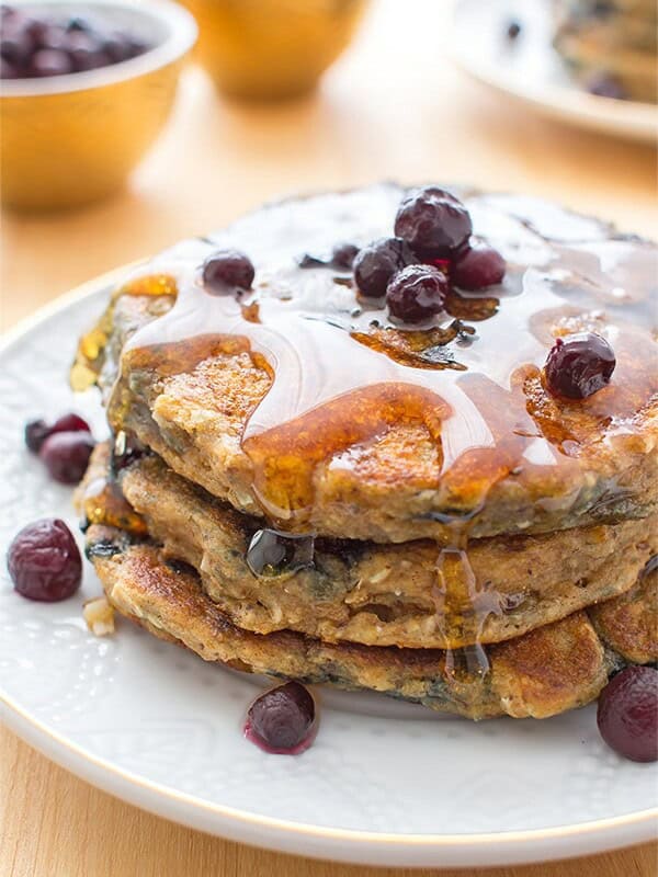 Vegan Blueberry Pancakes: An easy recipe for fluffy, moist blueberry pancakes that are perfect for a cozy breakfast or brunch. BEAMINGBAKER.COM #Vegan #OneBowl