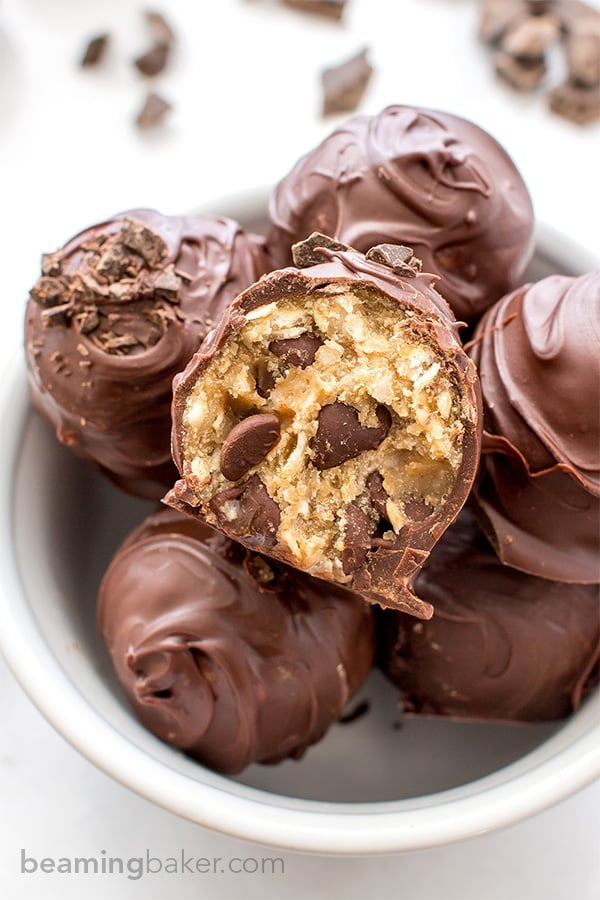 Chocolate Chip Cookie Dough Truffles (V+GF): Decadent chocolate chip cookie dough bites wrapped in a velvety blanket of rich, dark, indulgent chocolate. BEAMINGBAKER.COM. #Vegan #GlutenFree