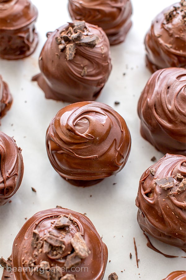 Chocolate Chip Cookie Dough Truffles (V+GF): Decadent chocolate chip cookie dough bites wrapped in a velvety blanket of rich, dark, indulgent chocolate. BEAMINGBAKER.COM. #Vegan #GlutenFree