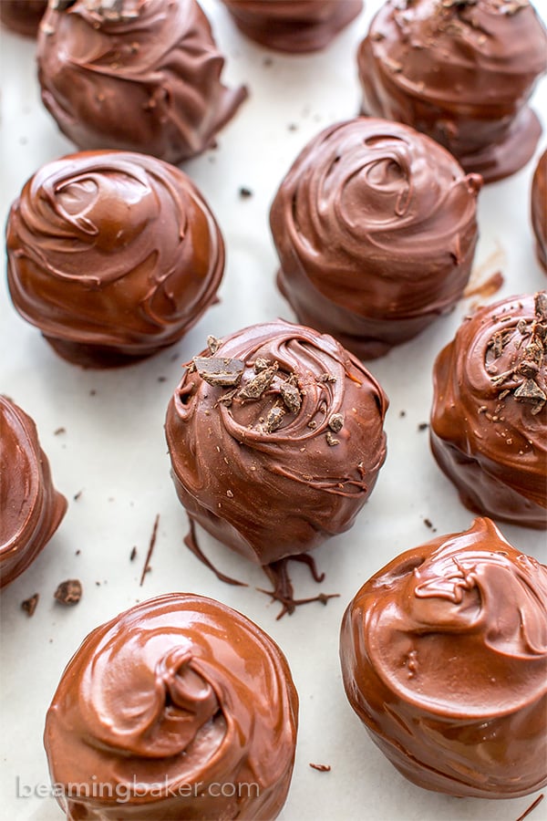 Chocolate Chip Cookie Dough Truffles (V+GF): Decadent chocolate chip cookie dough bites wrapped in a velvety blanket of rich, dark, indulgent chocolate. BEAMINGBAKER.COM. #Vegan #GlutenFree