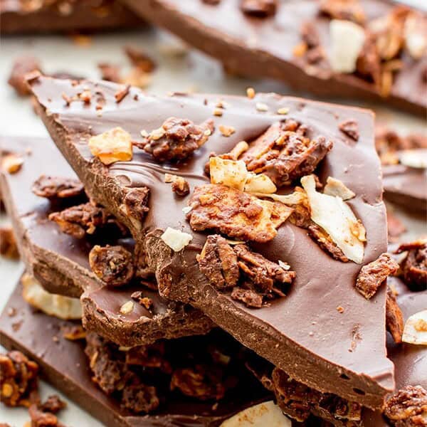 Chocolate Coconut Granola Bark (V+GF): Richly indulgent, heavenly chocolate covered coconut granola enrobed in a thick layer of chocolate. BeamingBaker.com #Vegan #GlutenFree