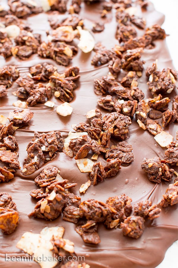 Chocolate Coconut Granola Bark (V+GF): Richly indulgent, heavenly chocolate covered coconut granola enrobed in a thick layer of chocolate. BeamingBaker.com #Vegan #GlutenFree