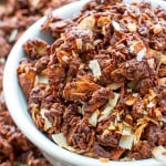 Chocolate Covered Coconut Granola (V+GF): A simple recipe for rich, chocolatey, crunchy granola covered in chocolate and coconut. BEAMINGBAKER.COM. #Vegan #GlutenFree