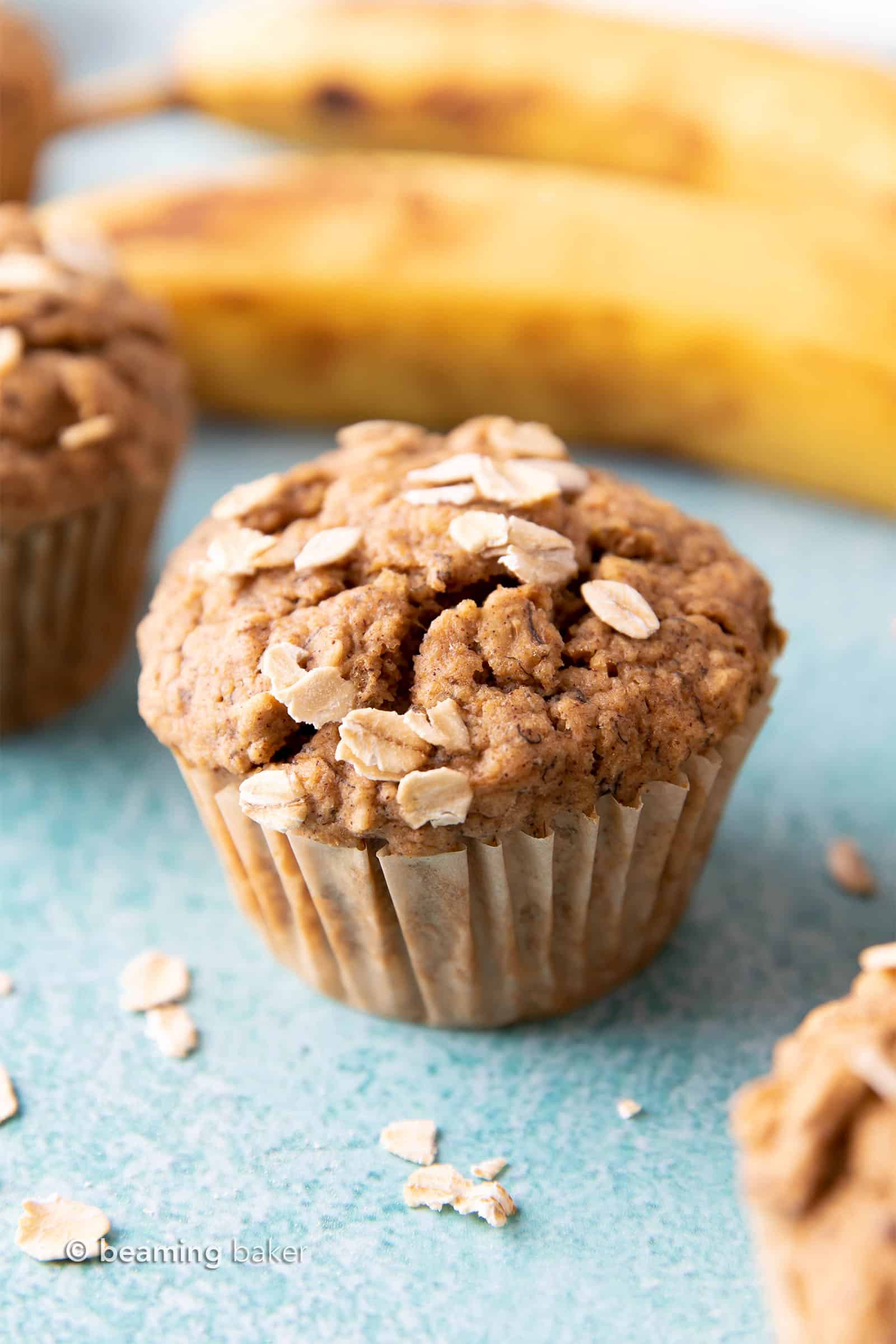 Gluten Free Banana Oat Muffins (V+GF): a one bowl recipe for warm, moist and lightly sweet Banana Oat Muffins made with simple ingredients. #vegan #glutenfree #breakfast #healthy | Recipe on BeamingBaker.com