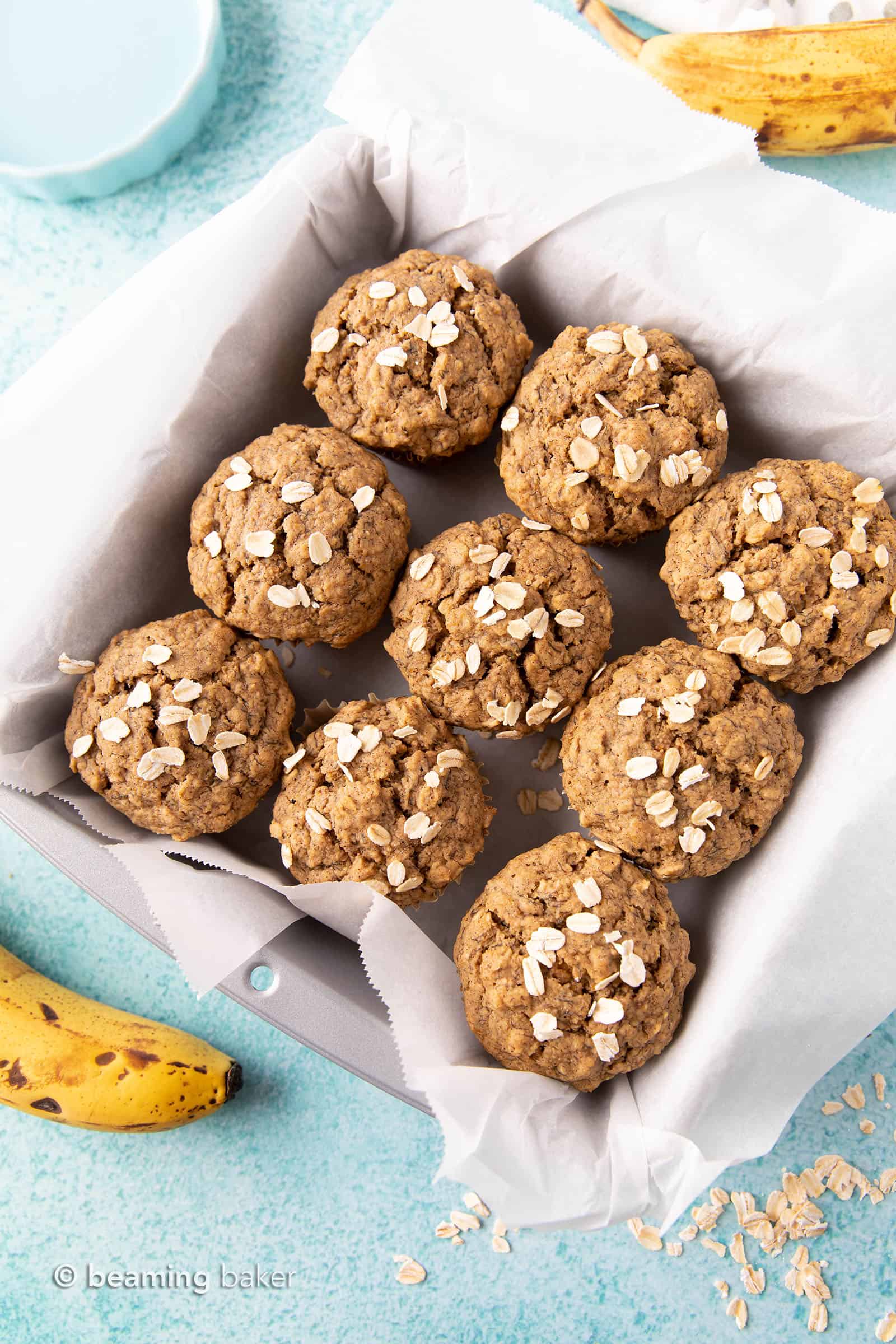 Gluten Free Banana Oat Muffins (V+GF): a one bowl recipe for warm, moist and lightly sweet Banana Oat Muffins made with simple ingredients. #vegan #glutenfree #breakfast #healthy | Recipe on BeamingBaker.com