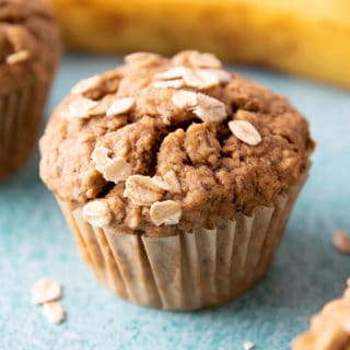 Gluten Free Banana Oat Muffins (V+GF): a one bowl recipe for warm, moist and lightly sweet Banana Oat Muffins made with simple ingredients. #vegan #glutenfree #breakfast #healthy | Recipe on BeamingBaker.com