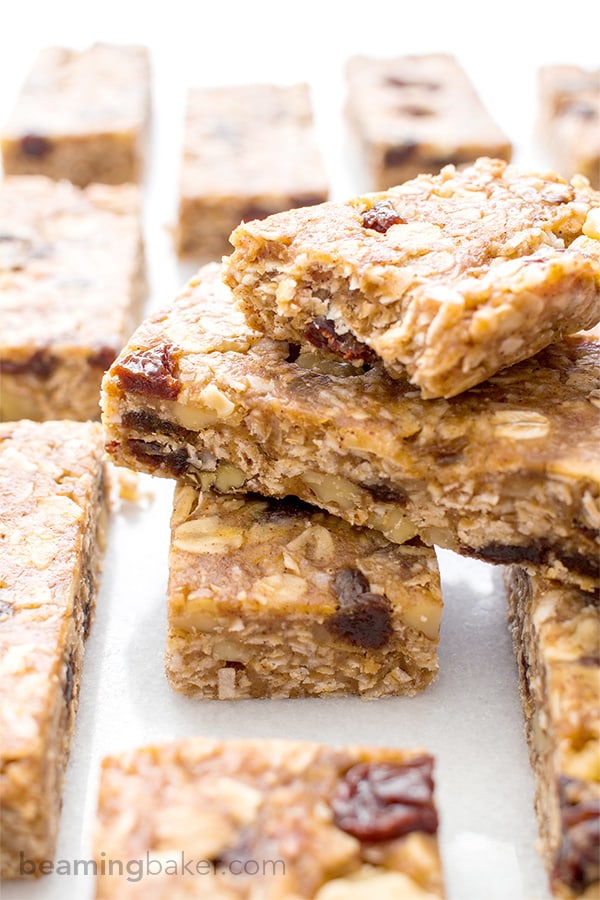 No Bake Oatmeal Raisin Granola Bars (V+GF): Soft and chewy granola bars that taste just like an oatmeal raisin cookie. An easy Vegan and Gluten Free recipe made with whole ingredients. BEAMINGBAKER.COM #Vegan #GlutenFree