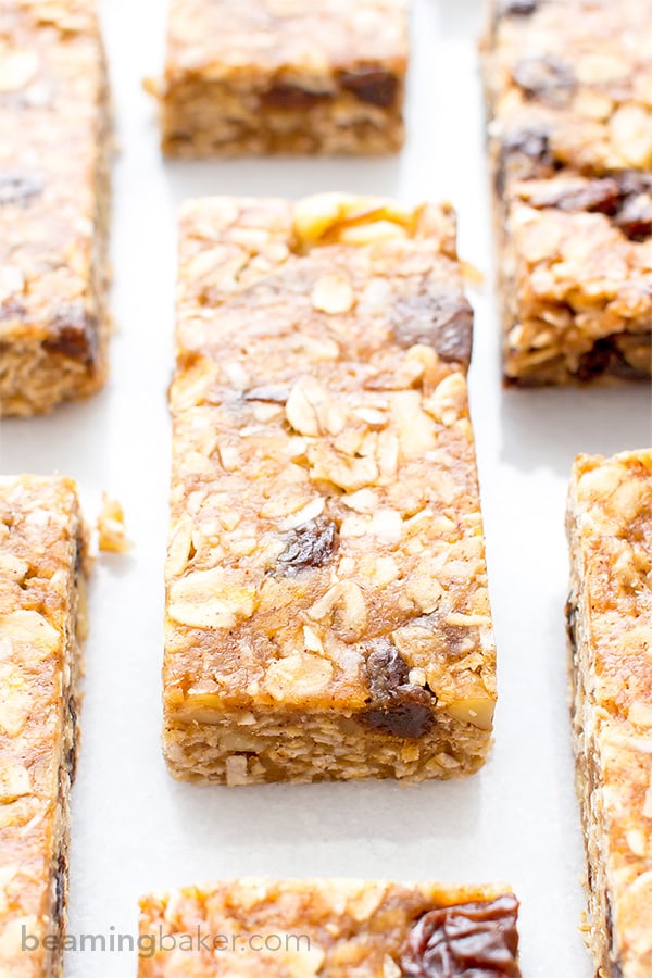 No Bake Oatmeal Raisin Granola Bars (V+GF): Soft and chewy granola bars that taste just like an oatmeal raisin cookie. An easy Vegan and Gluten Free recipe made with whole ingredients. BEAMINGBAKER.COM #Vegan #GlutenFree