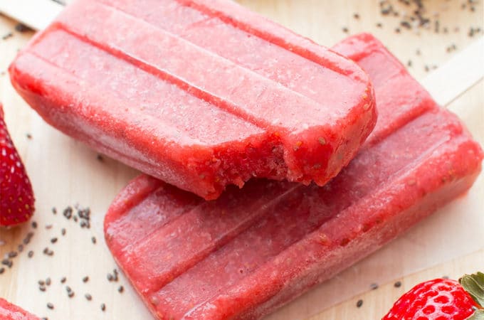 Vegan Strawberry Chia Seed Popsicles (V+GF): a 3 ingredient recipe for delicious, refreshing strawberry popsicles bursting with chia seeds. #Vegan #DairyFree #GlutenFree | BeamingBaker.com
