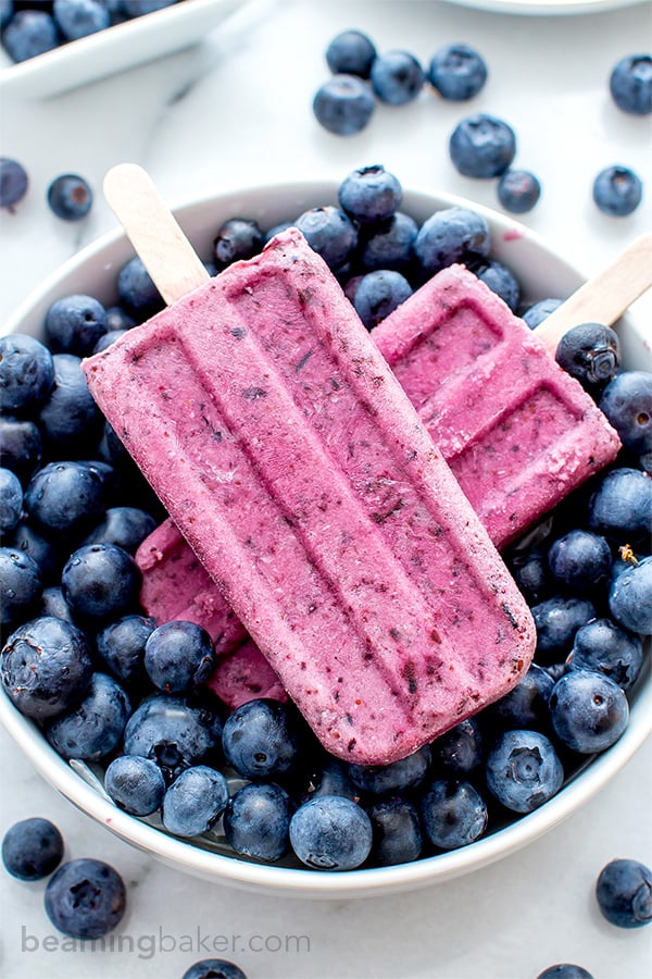 Vegan Blueberry Coconut Popsicles (V+GF): a 3 ingredient recipe for creamy popsicles packed with blueberries and coconut flavor. #Vegan #GlutenFree #DairyFree | BeamingBaker.com