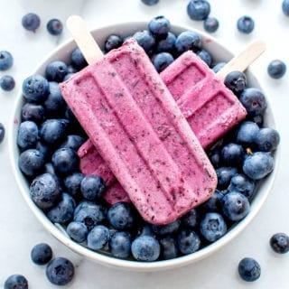 Vegan Blueberry Coconut Popsicles (V+GF): a 3 ingredient recipe for creamy popsicles packed with blueberries and coconut flavor. #Vegan #GlutenFree #DairyFree | BeamingBaker.com